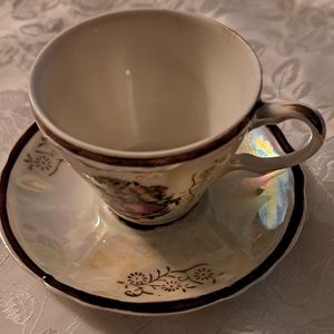 Tiny China cup and saucer
